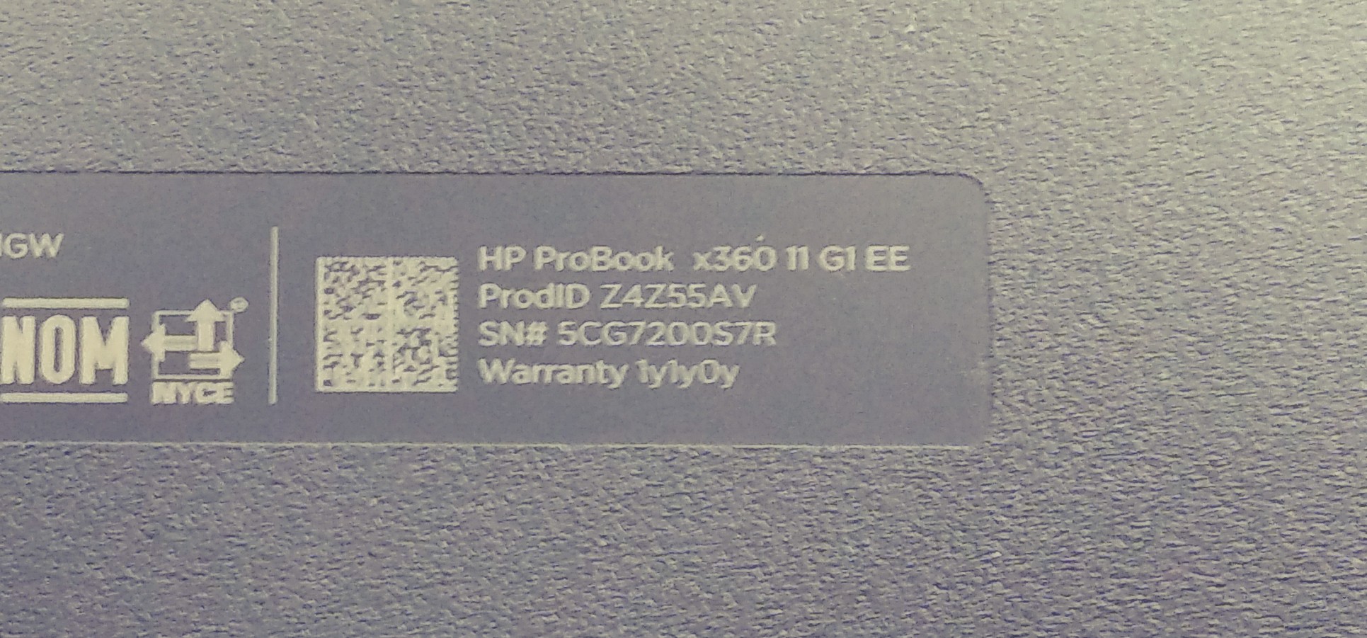 Example serial-number label on the underside of an HP laptop